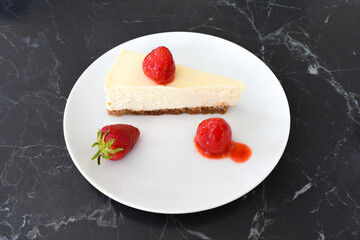 american cheesecake with strawberries on table