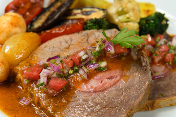 delicious dish with stuffed meat and grilled vegetables