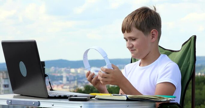 the boy in headphones is working on a laptop and something went wrong fail