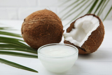 coconut oil and coconuts on the table
