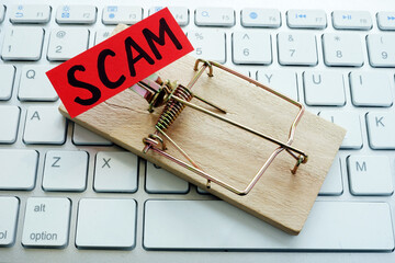 Mousetrap and word scam on the keyboard for internet. Identity Theft.