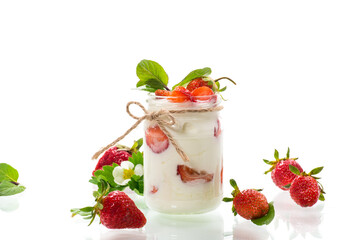 sweet homemade yogurt with ripe fresh strawberries in a jar