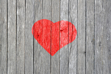 drawing of a symbol of love on an wooden wall. A heart