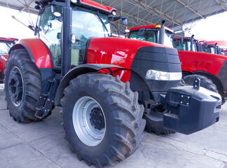 Obraz premium The colorful tractors in the road