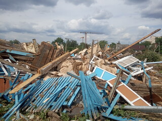 wreckage of an old destroyed wooden house, demolition of a private sector