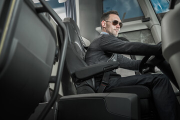 Caucasian Male Coach Bus Driver Behind Vehicle Wheel