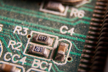 dusty printed circuit Board with components . macro selective focus