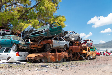 Mexico City / Mexico. June 19 2020: Old Cars Piled up in a Metal Recycling Yard Waiting to be Dismantled and Crushed.