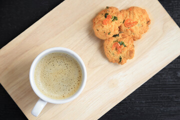 Top view of coffee cup and dried shrimps cookies, Thai style homemade cookies.