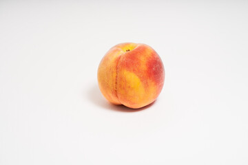                                Fresh peach on white background