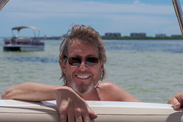 Man in Water at Side of Boat