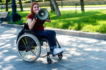 Disabled girl with a megaphone in her hand
