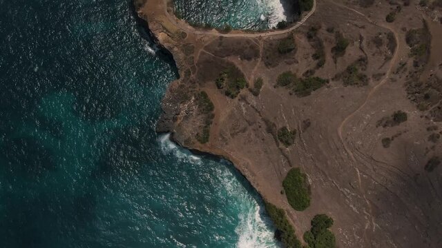 Aerial 4K zenith with forward movement view of Broken beach in Nusa Penida island in Bali - Indonesia