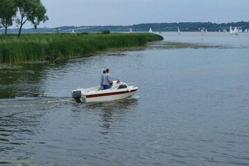 Fototapeta na wymiar A motor boat swiming out onto Vistula river in Poland 