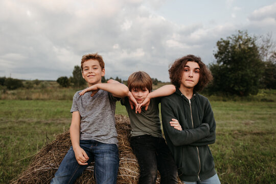 Young brothers in a corn green field