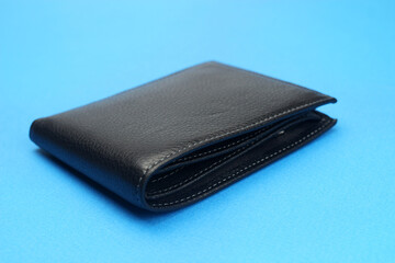 wallet black leather on a blue background