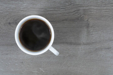 Cup of coffee on a dark wood background. Cup of coffee.