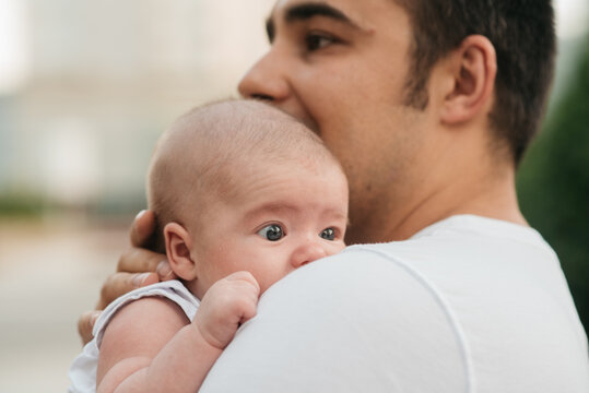 Dad with a baby in arms.