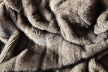 The texture of the fluffy gray fur of a fur coat