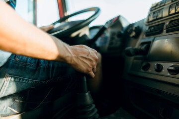 Scene of a truck driver driving on the road.