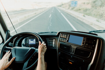 Scene of a truck driver driving on the road.