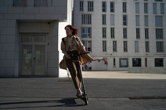 Woman exploring the city on a electric scooter