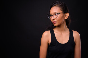 Obraz premium Portrait of young beautiful Asian woman with eyeglasses