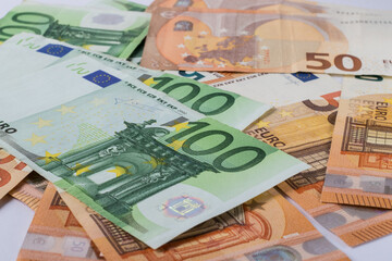 Medical face masks and money. Face mask on Euro banknotes bill background. Crisis, Covid-19.