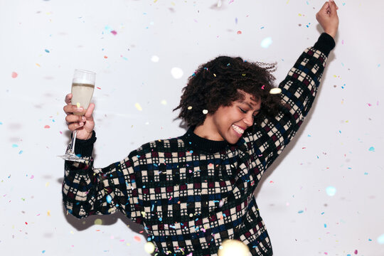 Mixed race woman celebrating a party