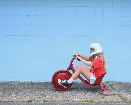 Girl Riding 3 Wheeler Outside