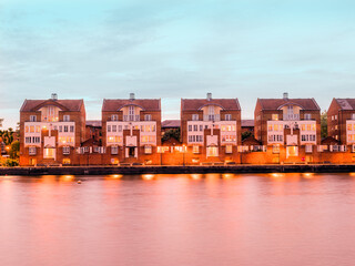 Traditional old house architecture on the riverside of the Thames river in the South area of London 