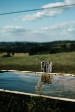 reflection of the sky in a water tank