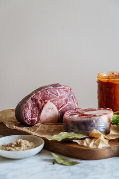 Pieces of raw meat on chopping board