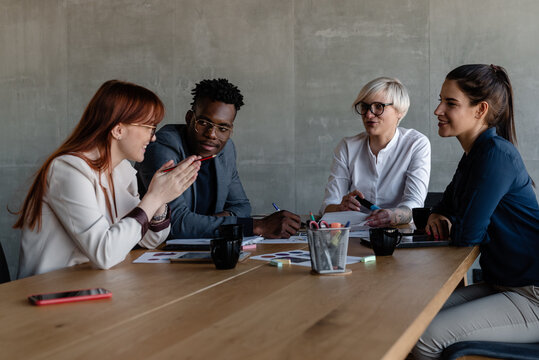 Creative young employees sharing with ideas