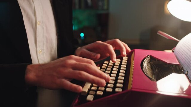 Details of a man type some text using a old typewriter in front of the camera. 4k