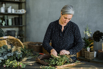 Woman Florist Assembling a Garland
