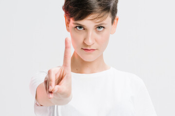 Portrait Of A Serious Young Woman Showing Stop Gesture