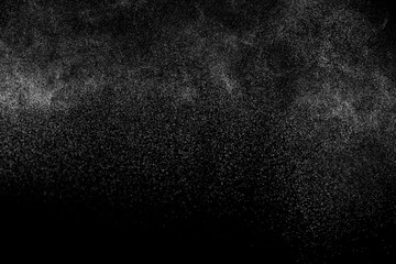 Fototapeta na wymiar Abstract splashes of water on black background. Freeze motion of white particles. Rain, snow overlay texture.