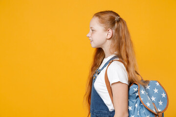YSide profile view young redhead school teen girl 12-13 years old pony tails in white t-shirt blue...