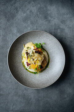 Sophisticated serving of dish with sauce and petals