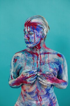 Blue and pink body art on turquoise background
