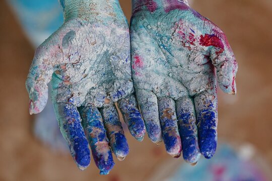 Anonymous model showing painted palms - Powered by Adobe