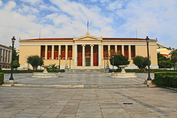 Obraz premium Front street view across the square of the National and Kapodistrian University of Athens, Greece. Usually referred to as the University of Athens which is a public university.