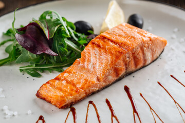 Grilled salmon fillet steak with salad