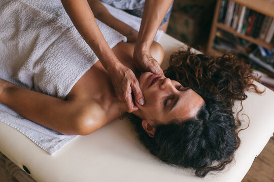 Woman having facial massage