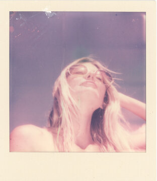 Colored polaroid prints of blonde woman in summer with blue sky and palm trees and tropical and fun.