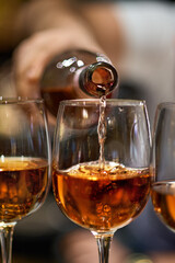 Close Up of Pouring Red Wine into Glass in Restaurant Setting