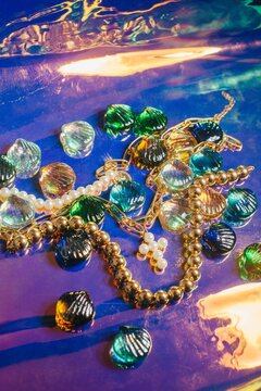 Pearl necklace amidst colorful stones
