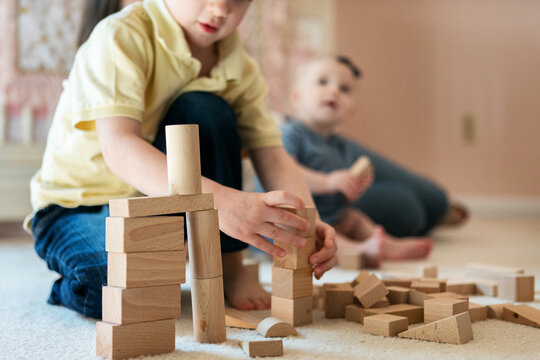 Family: Boy Plays With Building Blocks