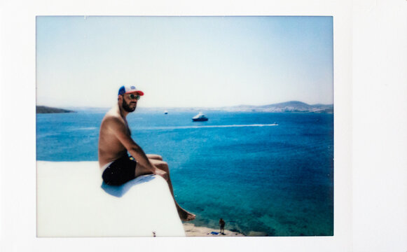 Instant photo of a man on vacations in Paros Island, Greece